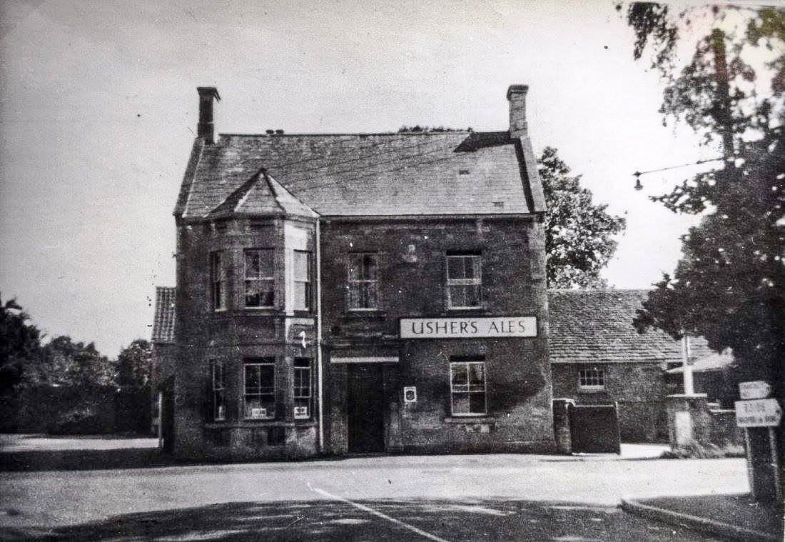 The photograph behind the reconstruction. The Usher's Ales board and the fingerpost to the right are the clearest dating evidence we have so far.
